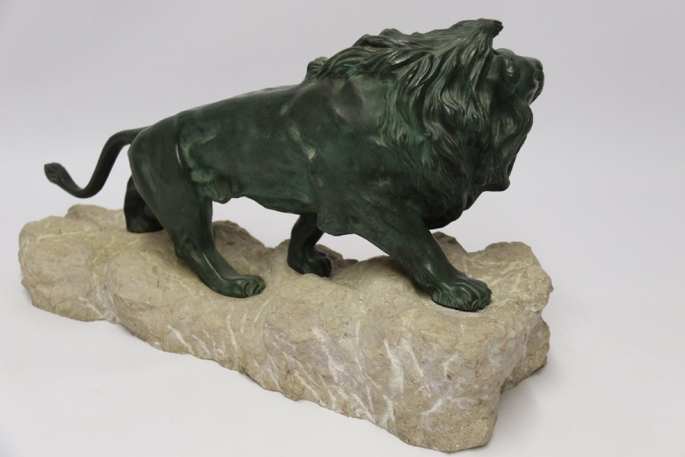 Early 20th century Bronze study of a Lion mounted on limestone base View IX