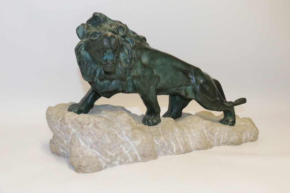 Early 20th century Bronze study of a Lion mounted on limestone base View XI