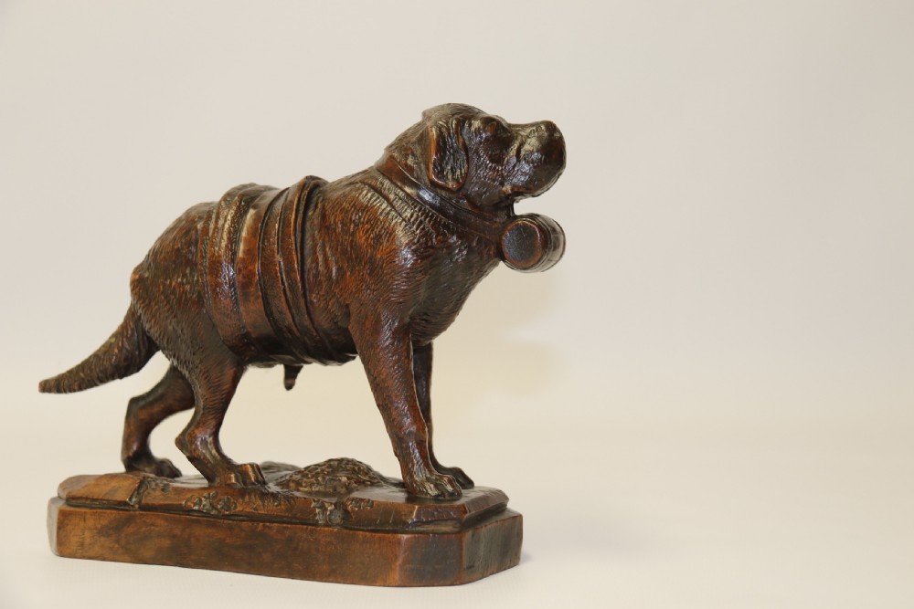 A fine study of a Black Forest carved walnut St Bernard Rescue Dog View II