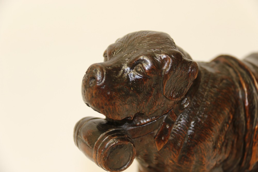 A fine study of a Black Forest carved walnut St Bernard Rescue Dog View III
