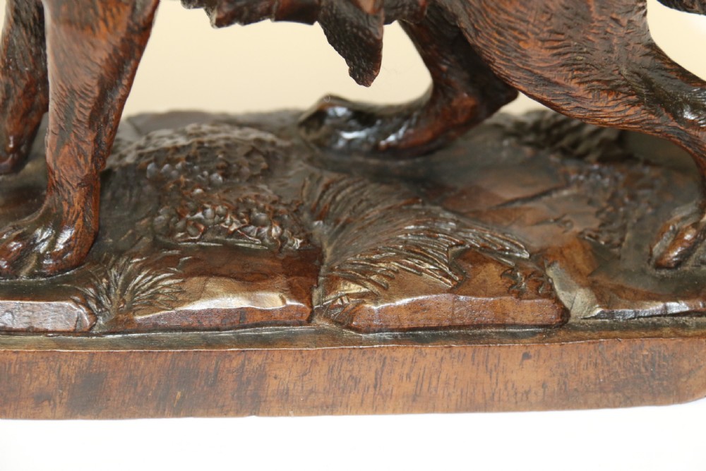 A fine study of a Black Forest carved walnut St Bernard Rescue Dog View IV