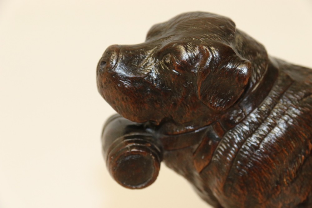A fine study of a Black Forest carved walnut St Bernard Rescue Dog View V