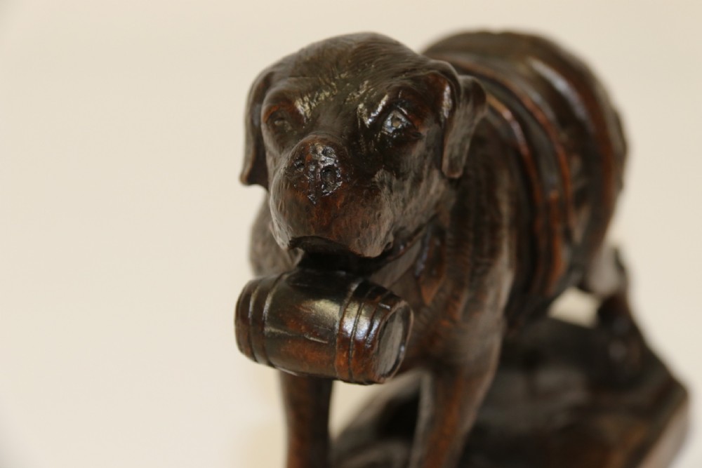 A fine study of a Black Forest carved walnut St Bernard Rescue Dog View VI