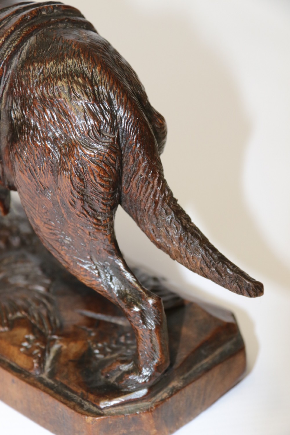 A fine study of a Black Forest carved walnut St Bernard Rescue Dog View VIII