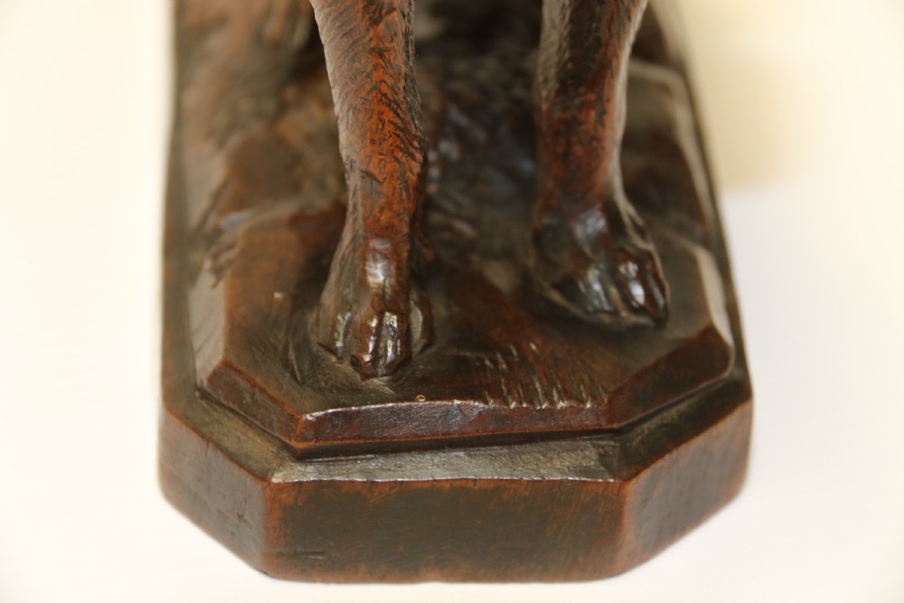 A fine study of a Black Forest carved walnut St Bernard Rescue Dog View IX