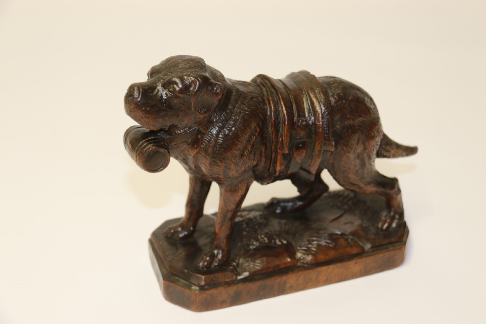 A fine study of a Black Forest carved walnut St Bernard Rescue Dog View X