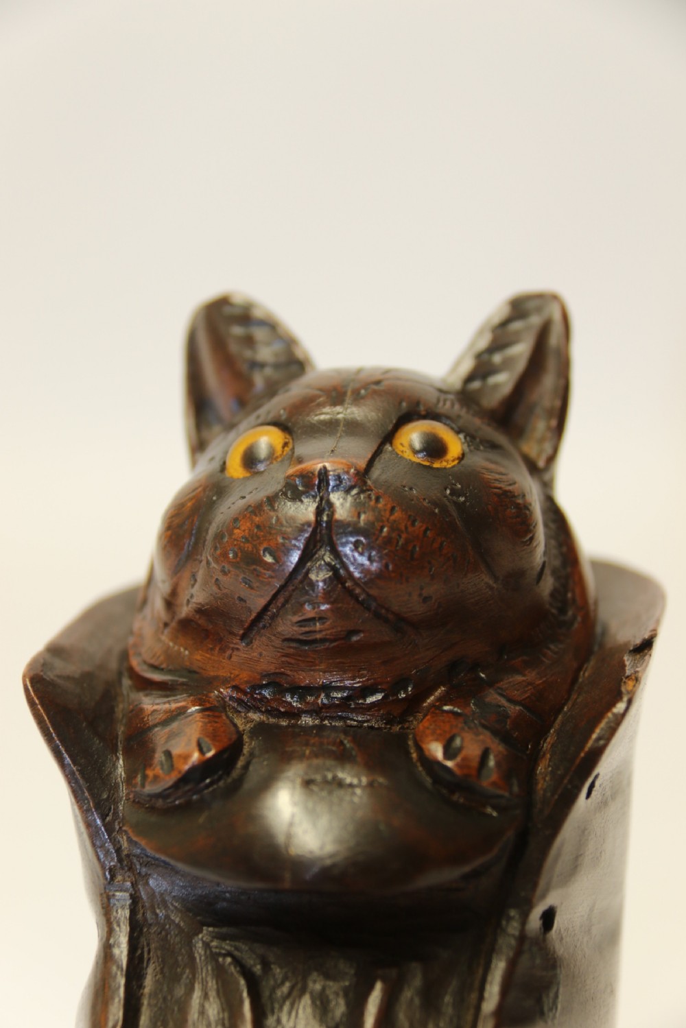 A Black Forest carved walnut kitten sitting in a boot View VI
