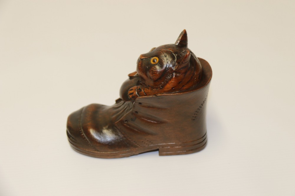 A Black Forest carved walnut kitten sitting in a boot View VII