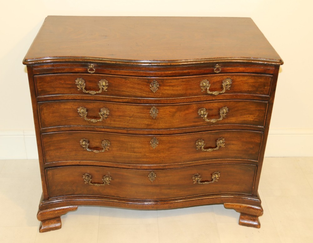 A Chippendale period Serpentine Fronted Mahogany Chest of Drawers