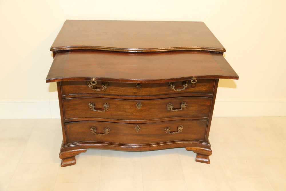 A Chippendale period Serpentine Fronted Mahogany Chest of Drawers View II
