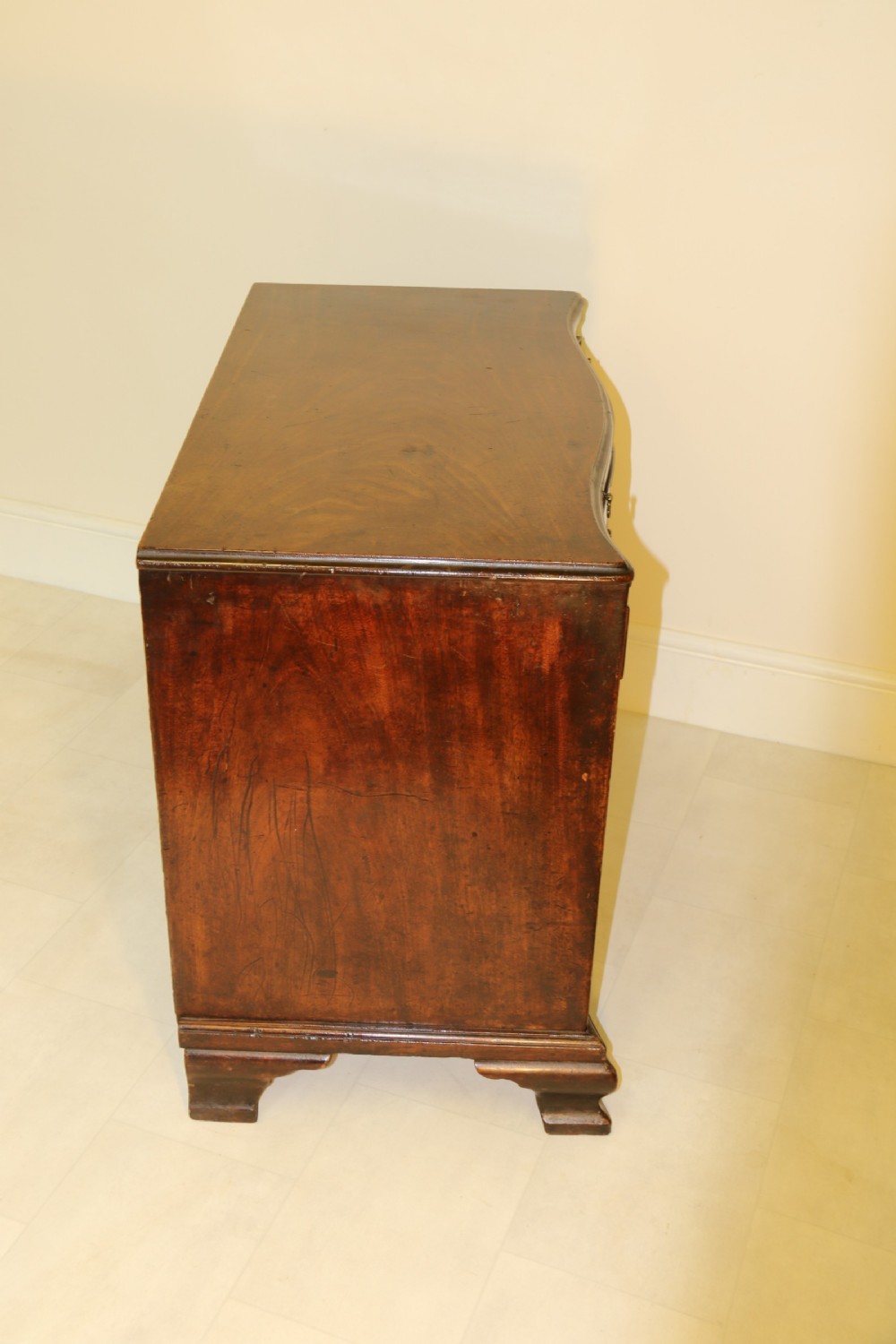 A Chippendale period Serpentine Fronted Mahogany Chest of Drawers View IX