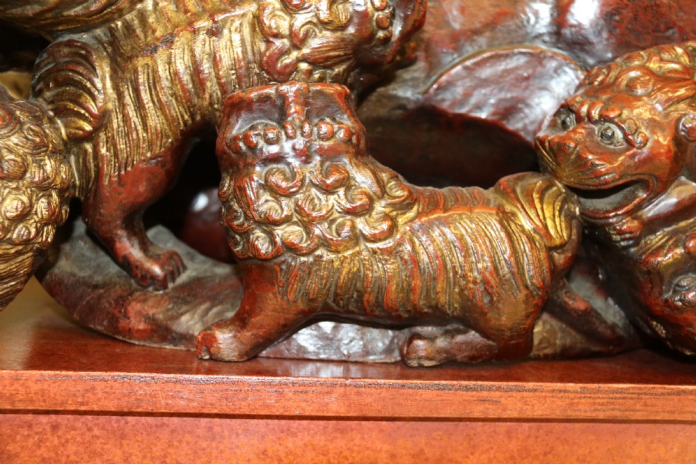 A rare pair of Chinese Mythical Beasts/Dogs of Foo on Stands View V