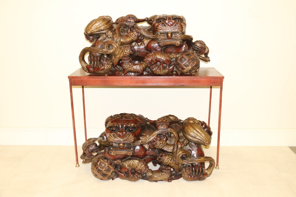 A rare pair of Chinese Mythical Beasts/Dogs of Foo on Stands View X