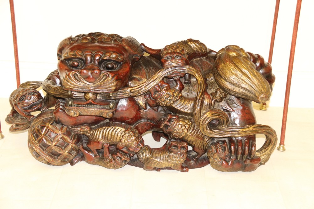 A rare pair of Chinese Mythical Beasts/Dogs of Foo on Stands View XI