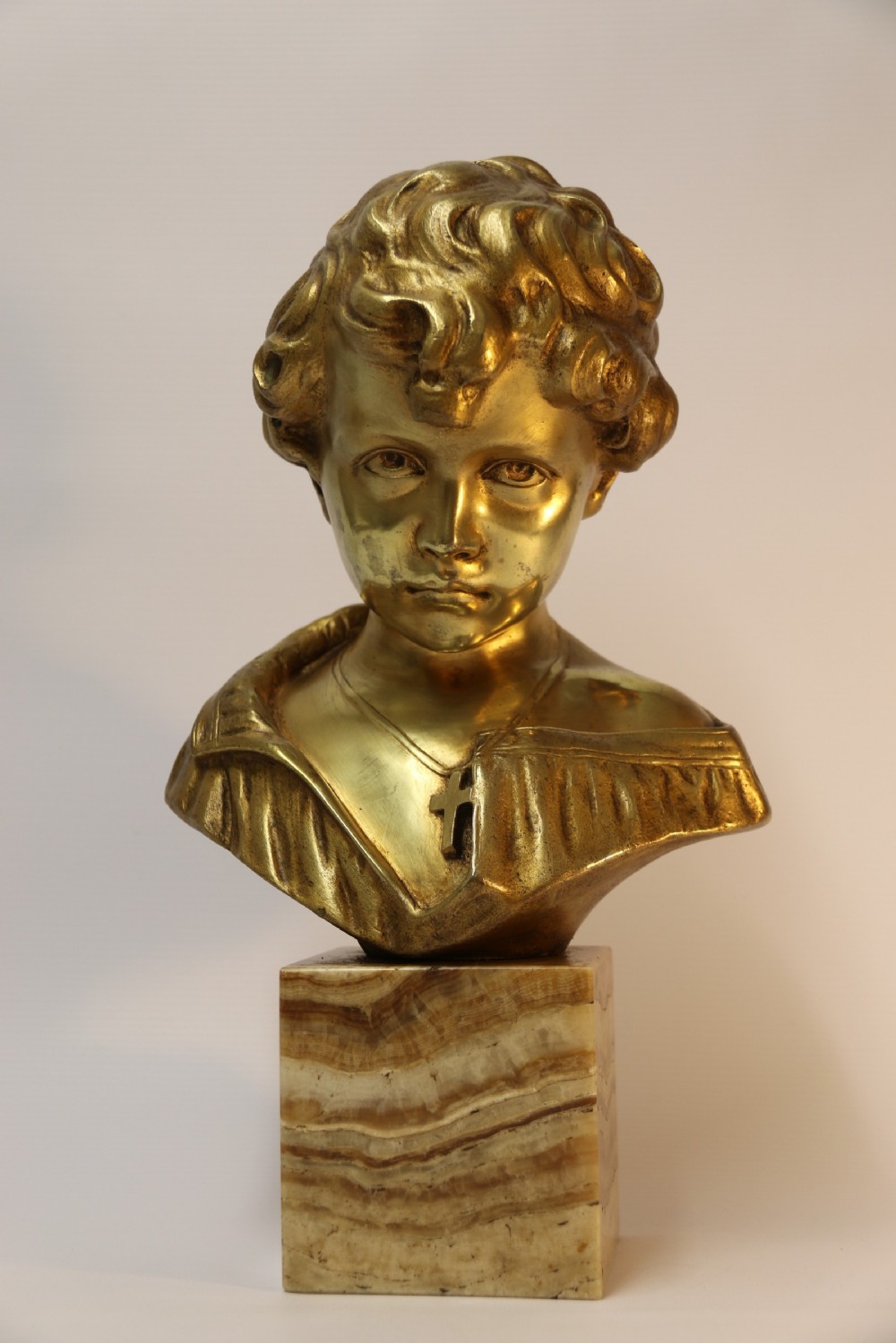 A gilt bronze bust of a boy after Donatello View II