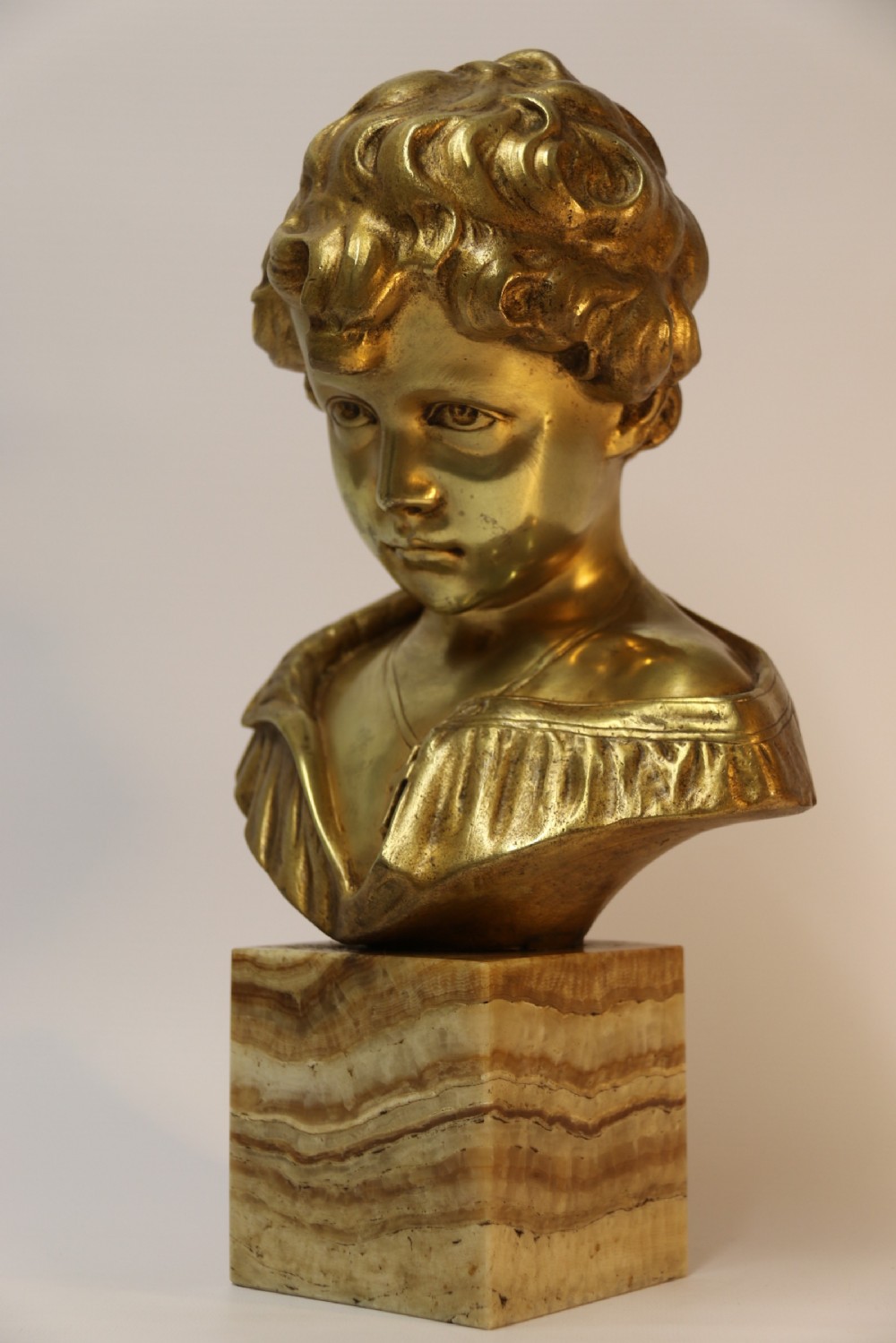 A gilt bronze bust of a boy after Donatello View III