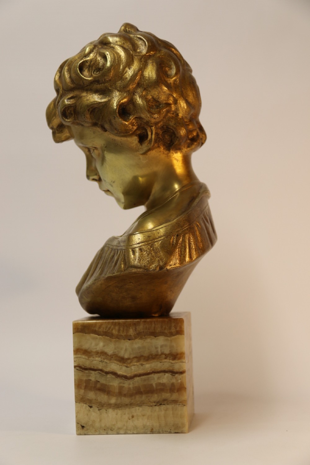 A gilt bronze bust of a boy after Donatello View IV