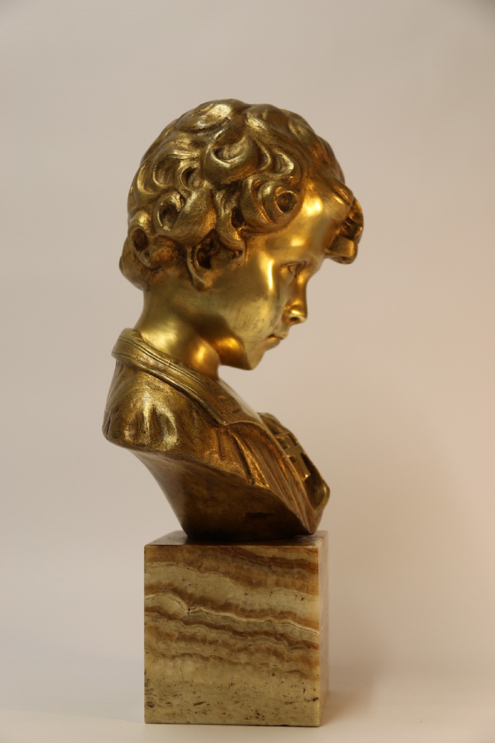 A gilt bronze bust of a boy after Donatello View VII