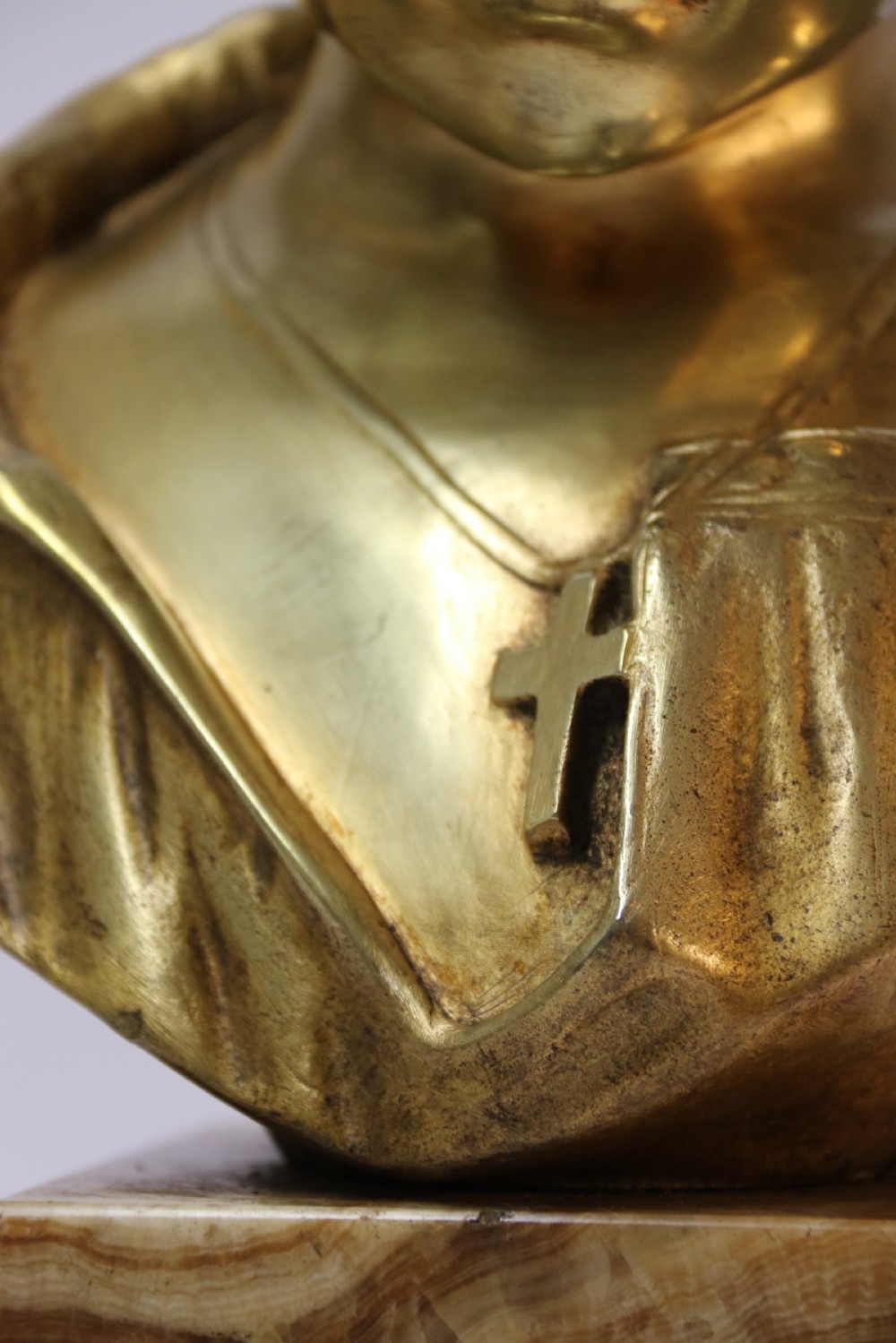A gilt bronze bust of a boy after Donatello View X