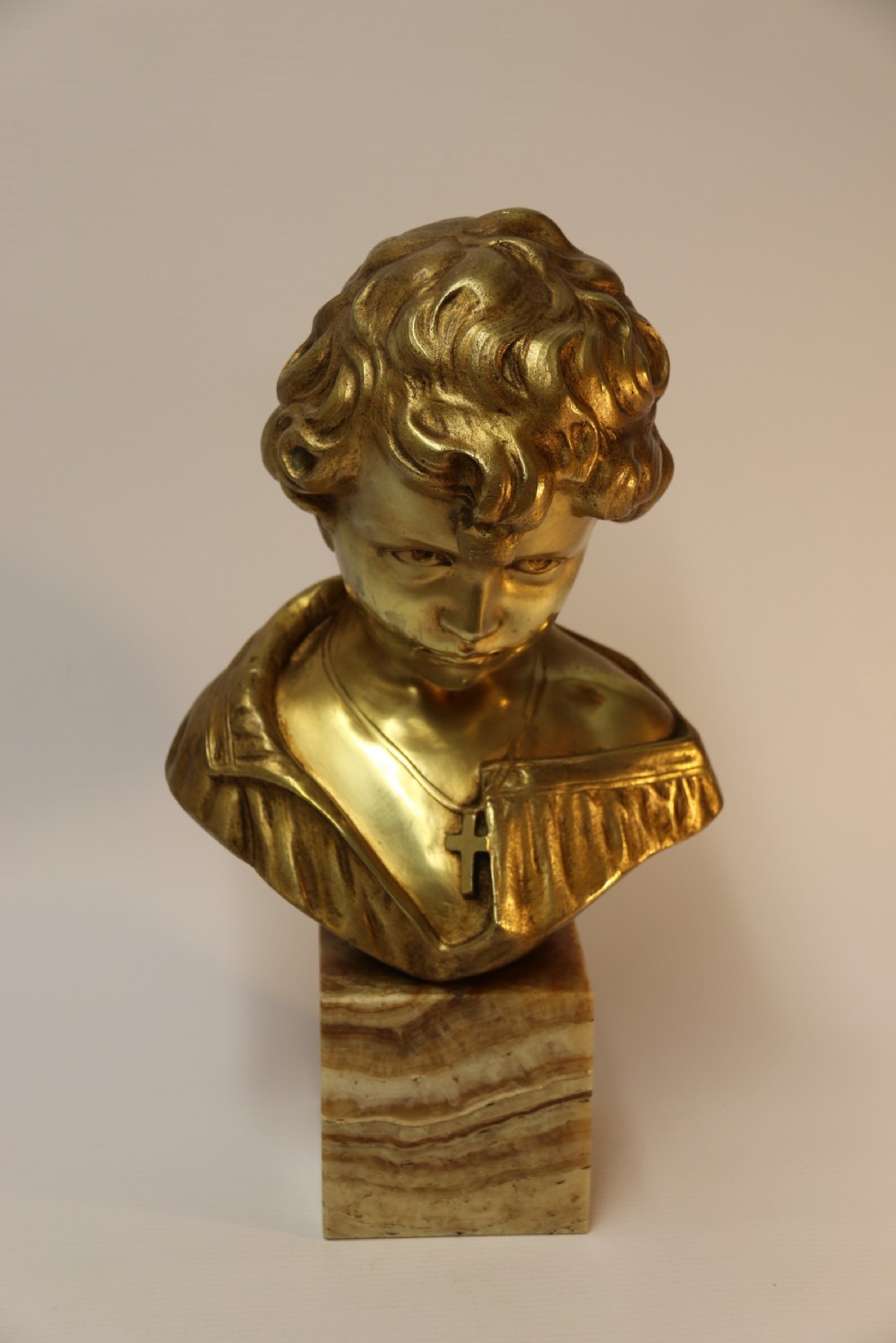 A gilt bronze bust of a boy after Donatello View XII