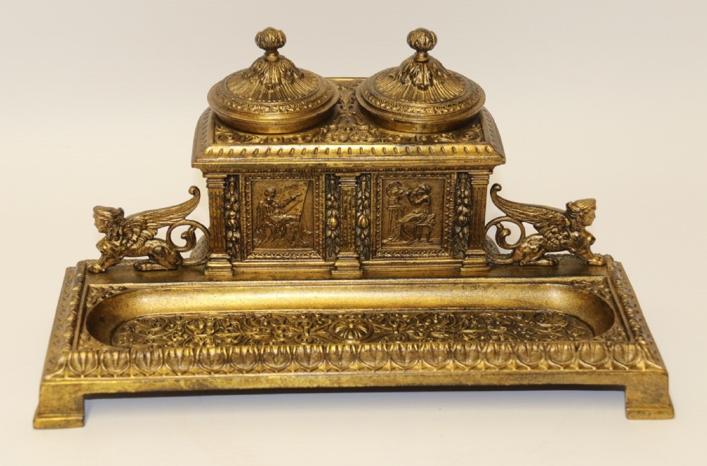 An early 19th century bronze Grecian pen and ink stand