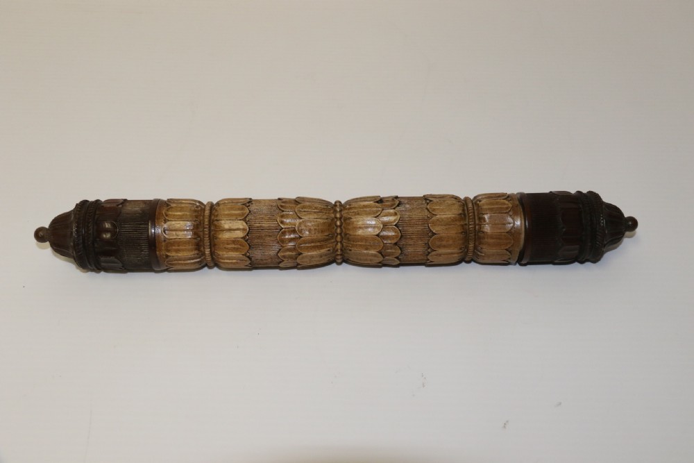 Two hand-carved fruitwood sewing cases featuring cylindrical shapes, leaf relief patterns, and turned finials. View II
