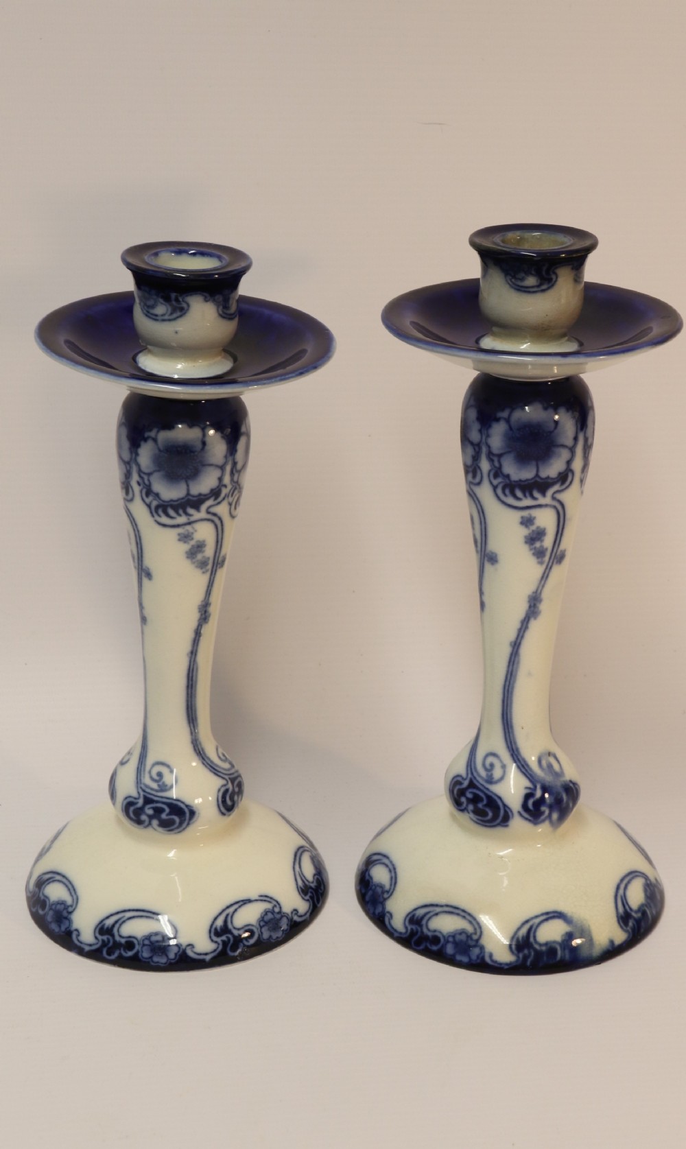 A pair of Art Nouveau Pottery Candle sticks
