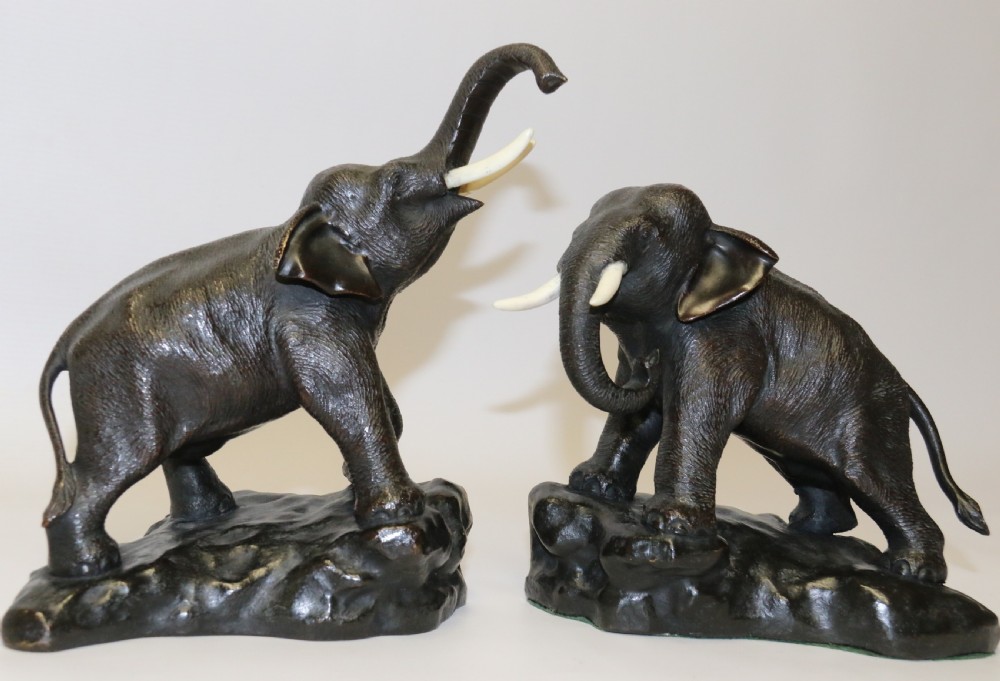 A pair of Japanese bronze elephant bookends Meiji Period, signed.