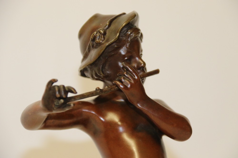 A 19th C Bronze figure of a Boy Playing a Flute, by Marcel Debut View III