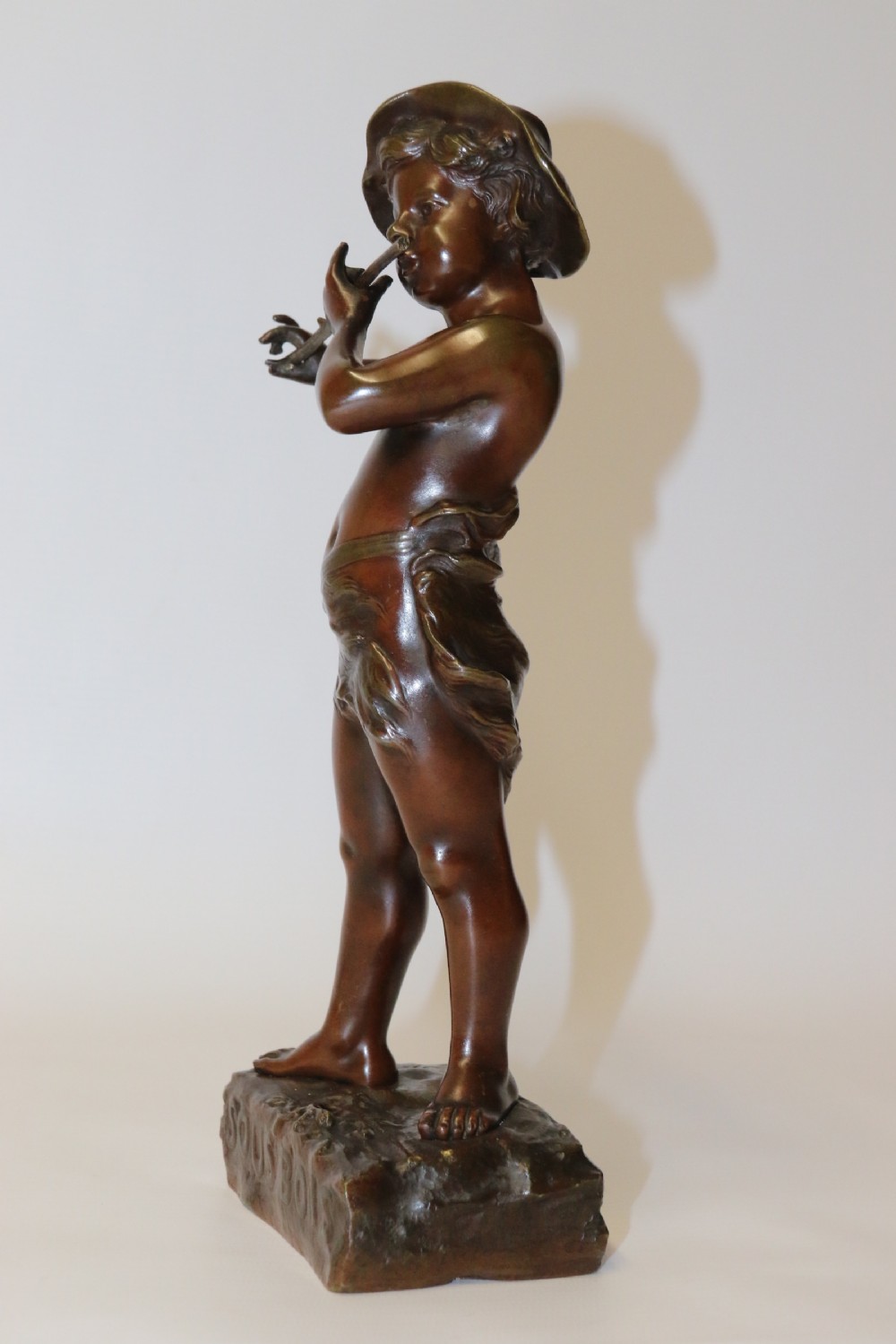 A 19th C Bronze figure of a Boy Playing a Flute, by Marcel Debut View VI