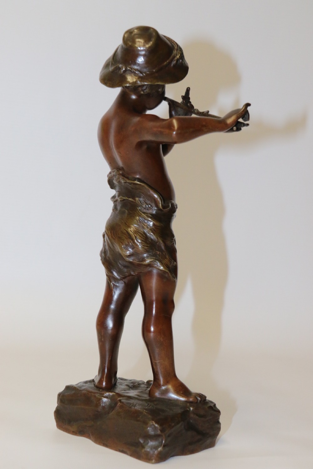 A 19th C Bronze figure of a Boy Playing a Flute, by Marcel Debut View VIII