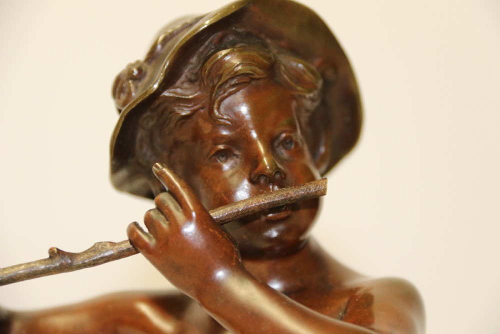 A 19th C Bronze figure of a Boy Playing a Flute, by Marcel Debut View IX