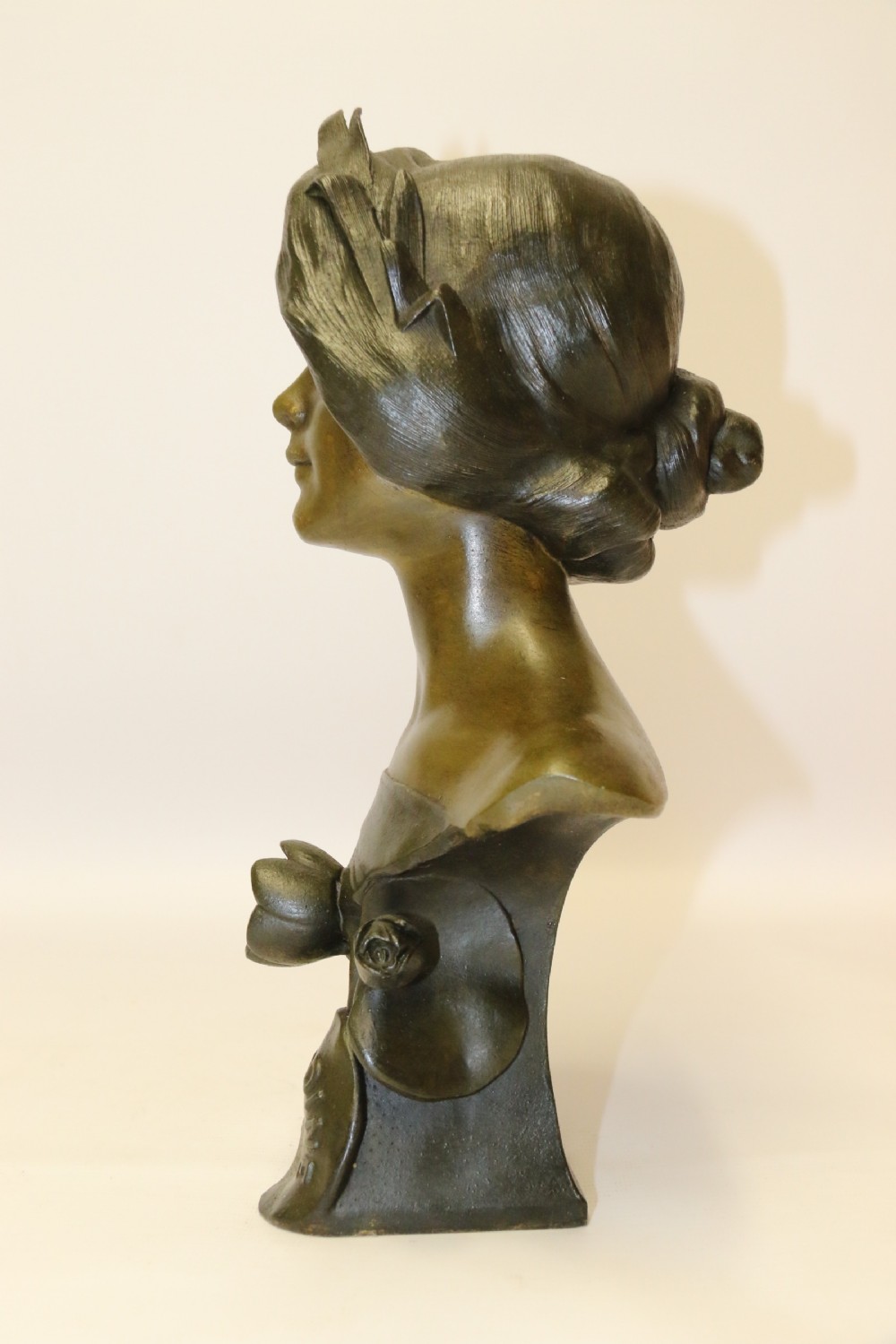An Art Nouveau Spelter bust of a beautiful young woman entitled Undine View VII