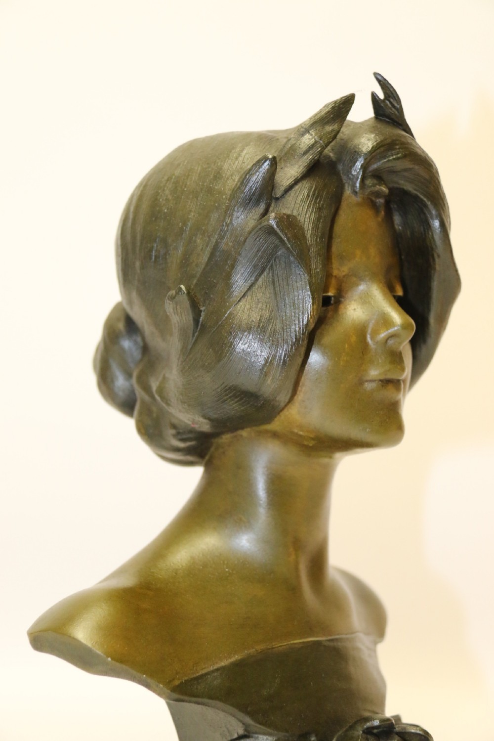 An Art Nouveau Spelter bust of a beautiful young woman entitled Undine View XII