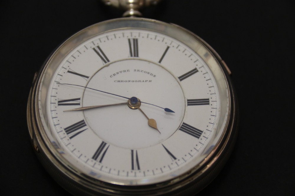 An Over sized Silver Chronograph Pocket Watch and Chain with Mining Tug of War Fob. View V