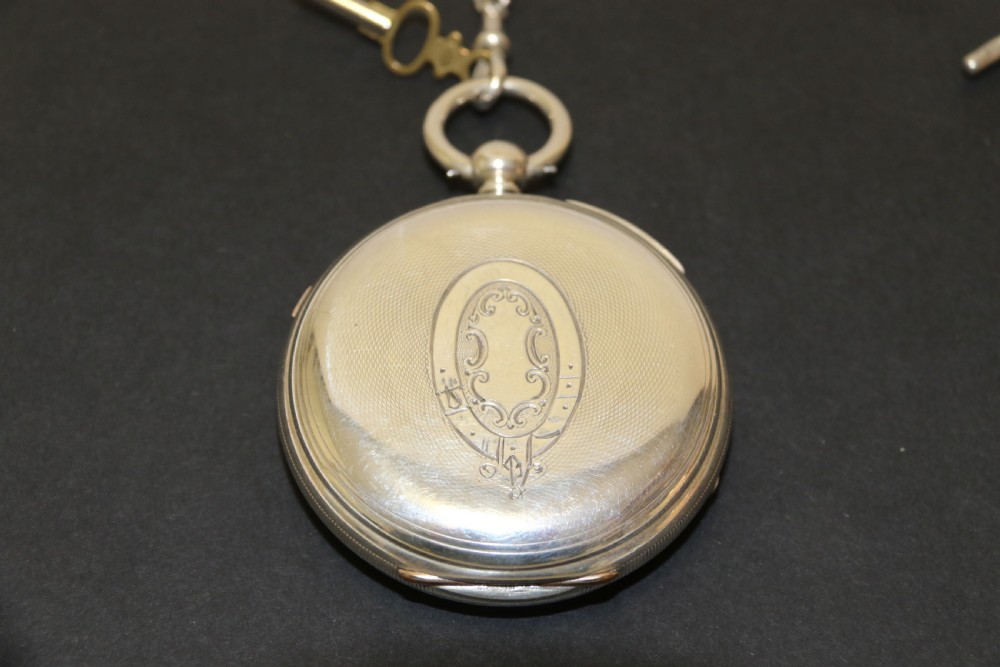 An Over sized Silver Chronograph Pocket Watch and Chain with Mining Tug of War Fob. View VI