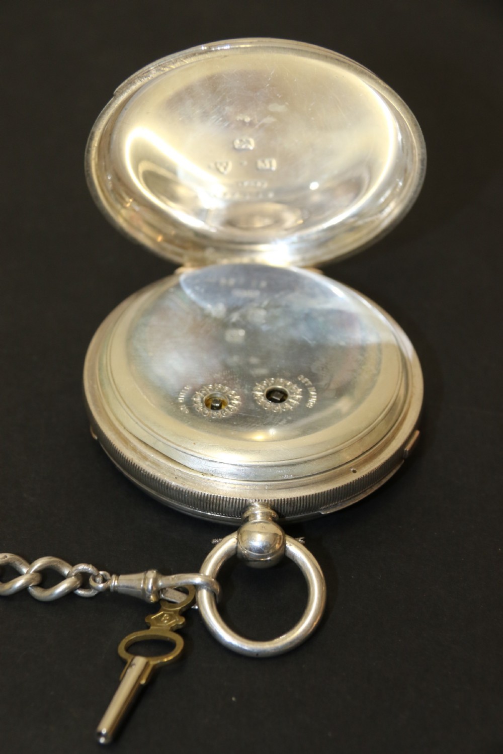 An Over sized Silver Chronograph Pocket Watch and Chain with Mining Tug of War Fob. View VII