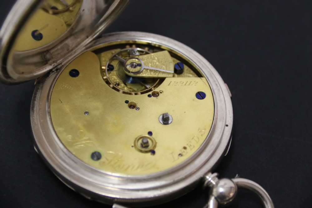 An Over sized Silver Chronograph Pocket Watch and Chain with Mining Tug of War Fob. View X