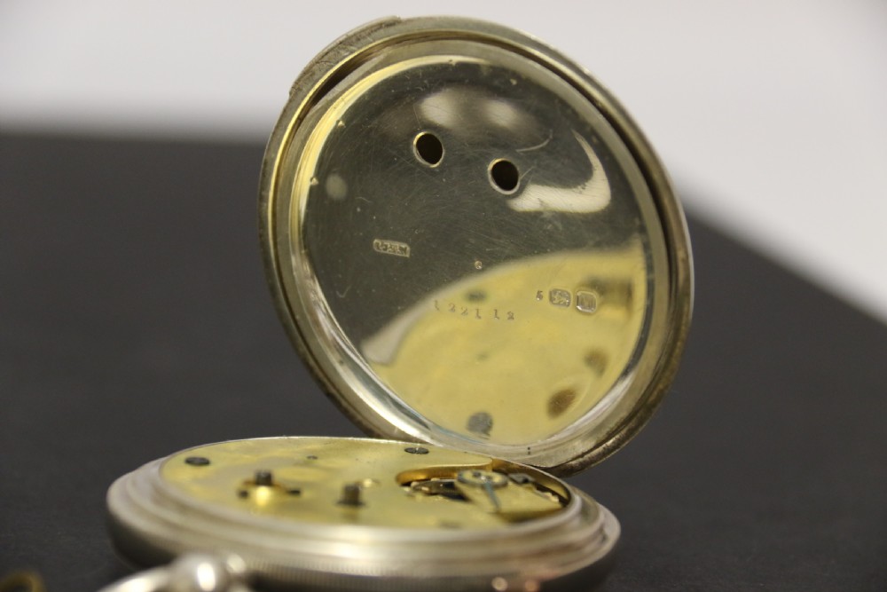 An Over sized Silver Chronograph Pocket Watch and Chain with Mining Tug of War Fob. View XII