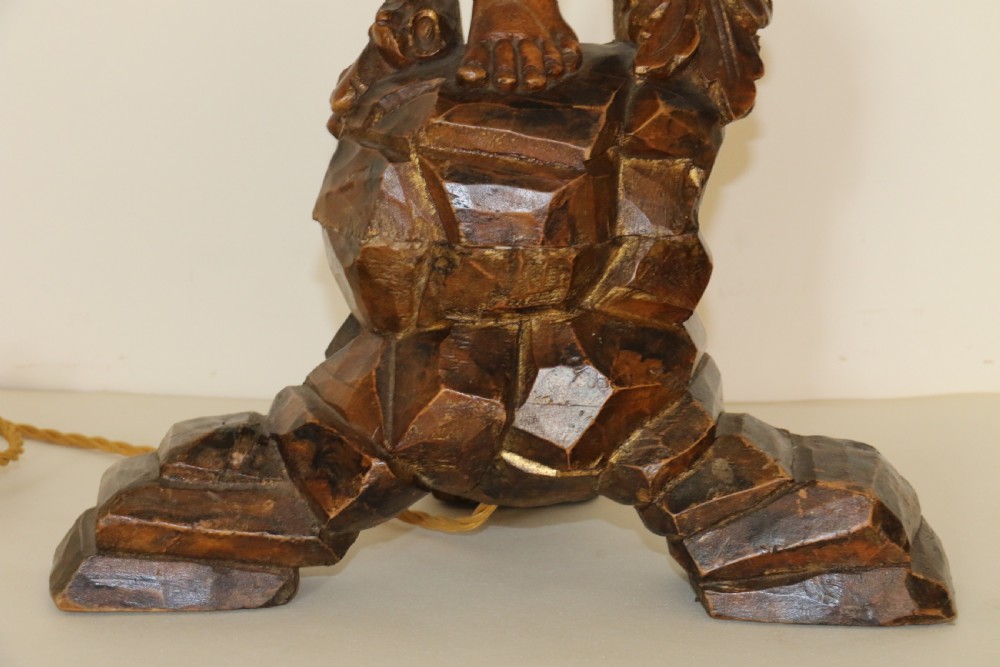 A large pair of carved wooden cherub lamps   View III