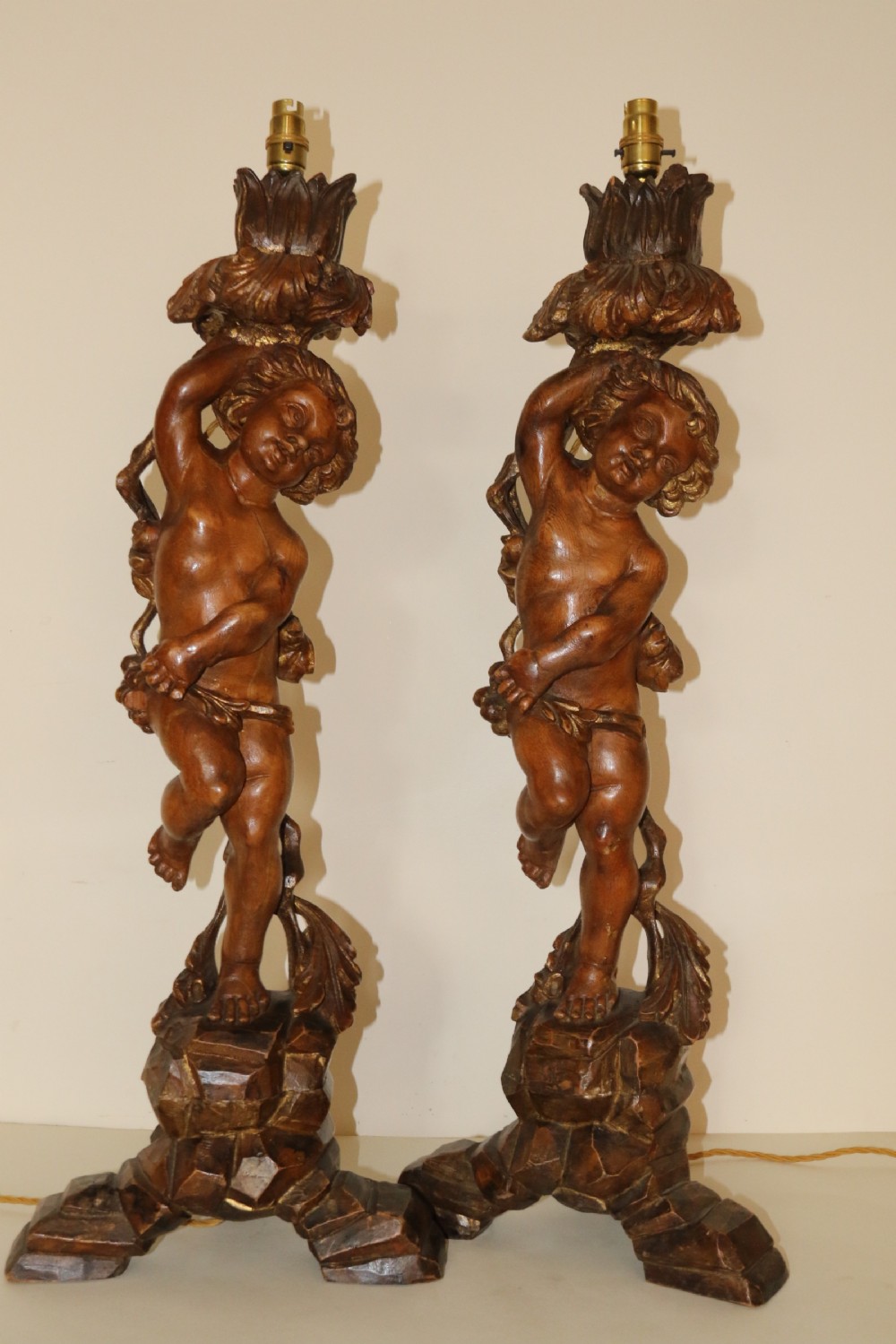 A large pair of carved wooden cherub lamps   View VII