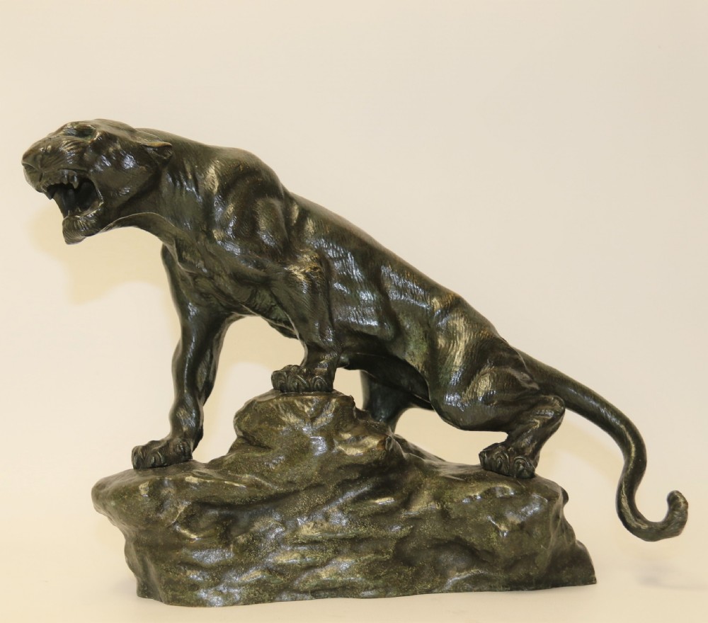 An early 20th Century Bronze Study of a Panther by Thomas Cartier
