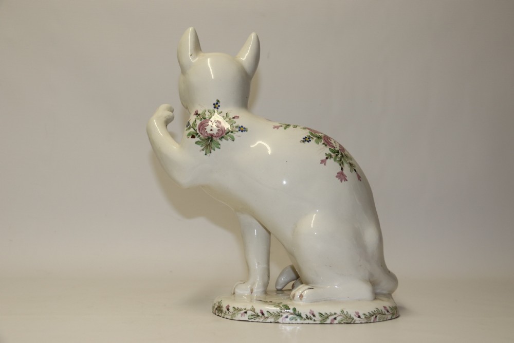 A large French early 20th C hand painted faience Pottery Cat. View VI