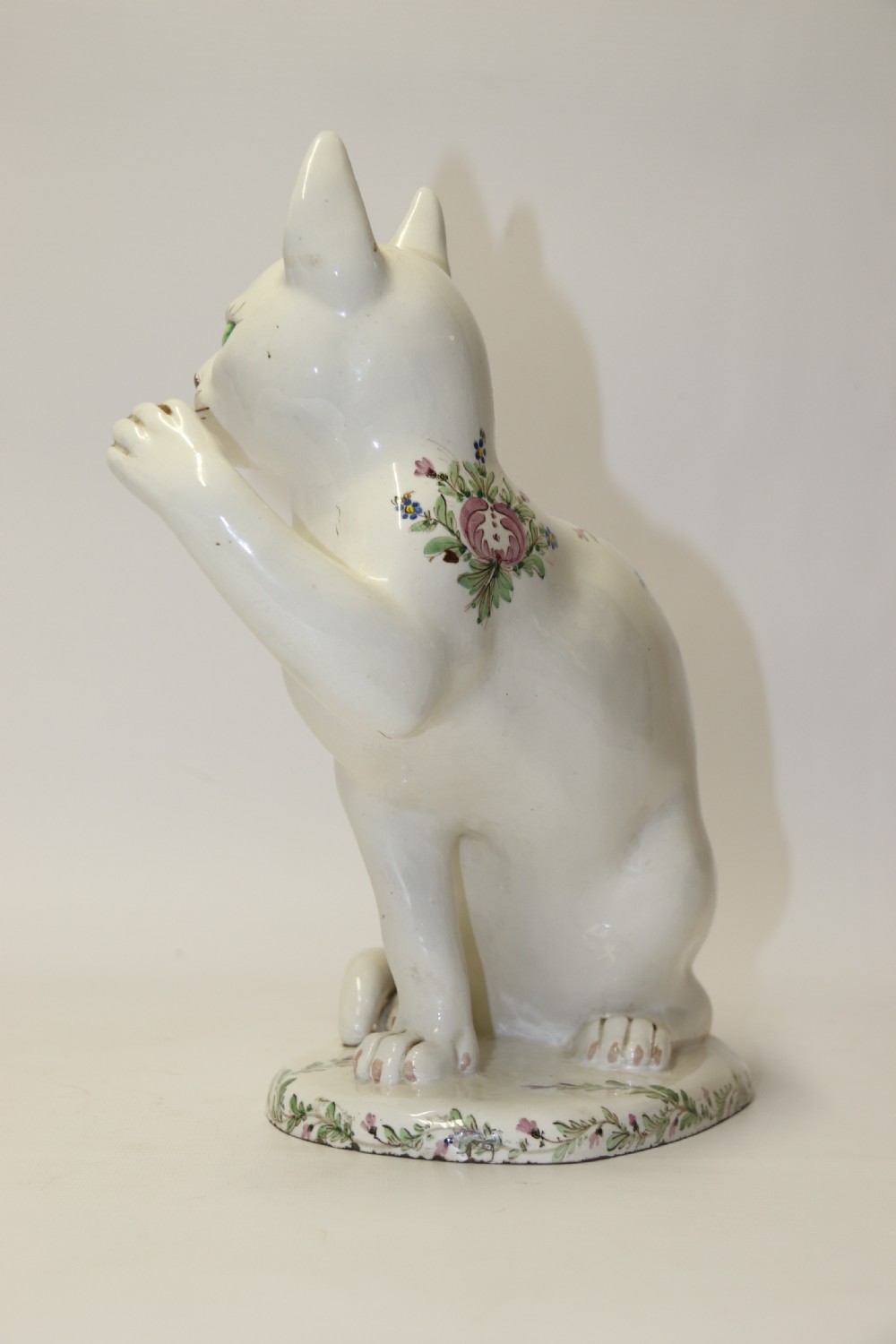 A large French early 20th C hand painted faience Pottery Cat. View VII