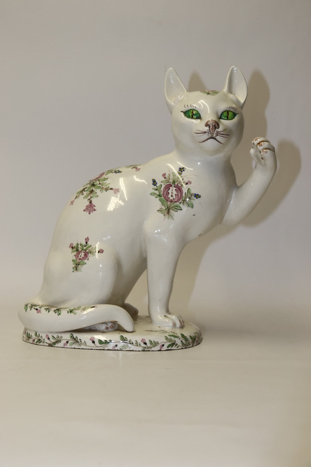 A large French early 20th C hand painted faience Pottery Cat. View XIII