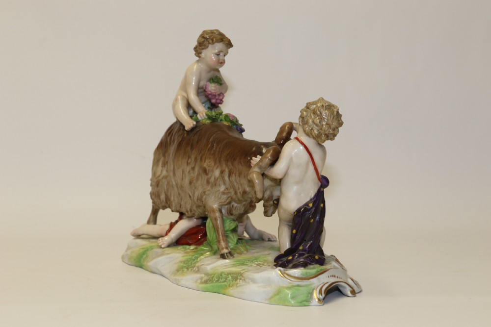 A fine Porcelain Figure Group of three Putti Wrestling with a Goat by Hochst Factory View IV
