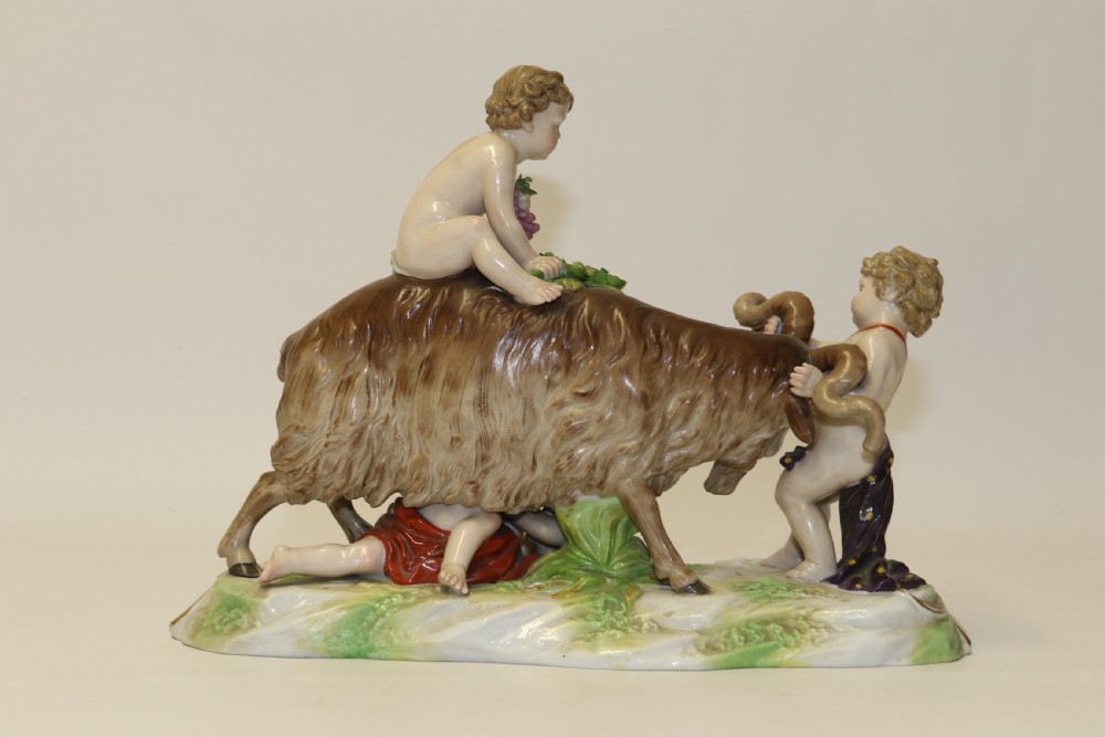 A fine Porcelain Figure Group of three Putti Wrestling with a Goat by Hochst Factory View V