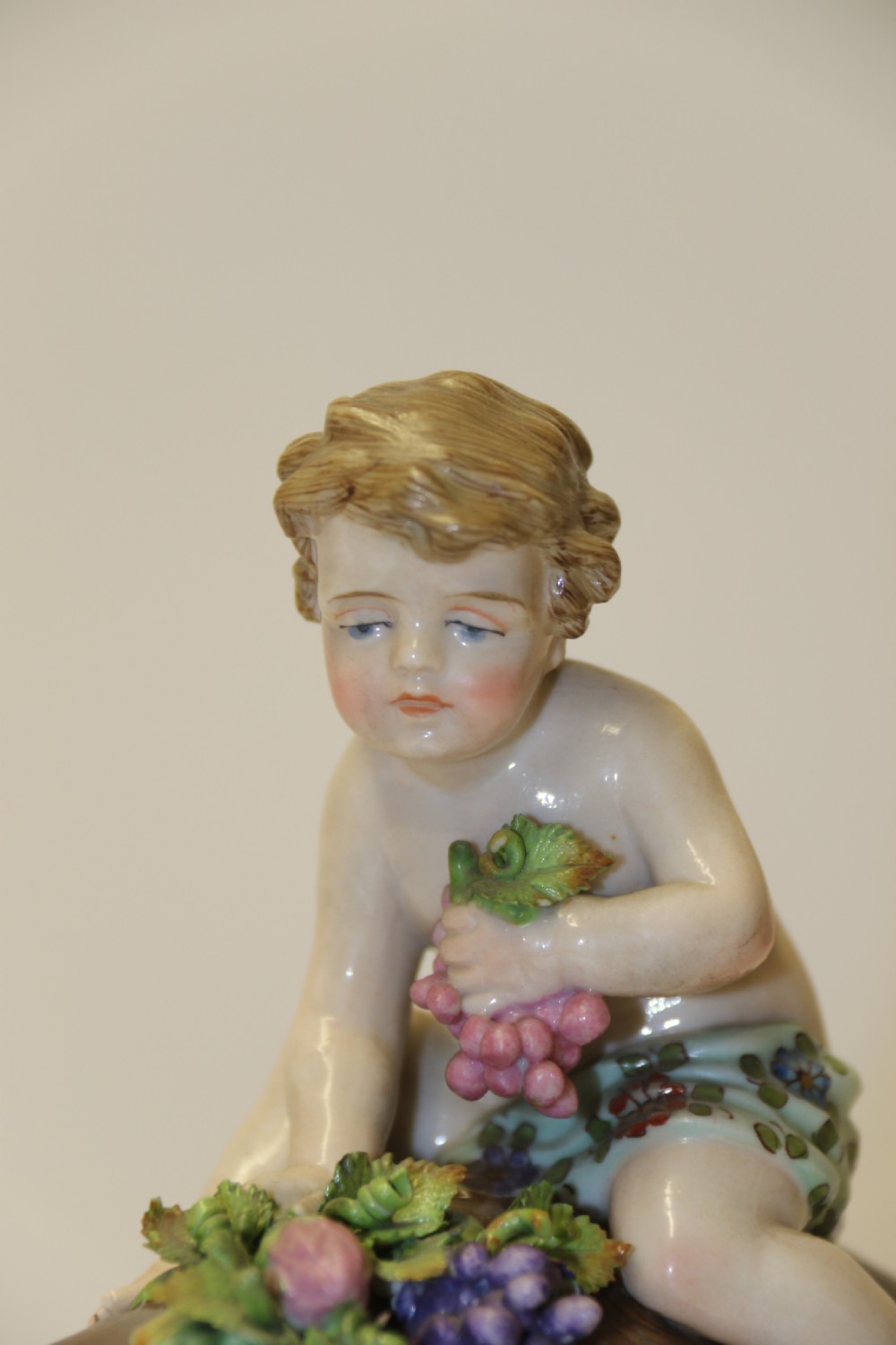 A fine Porcelain Figure Group of three Putti Wrestling with a Goat by Hochst Factory View VIII