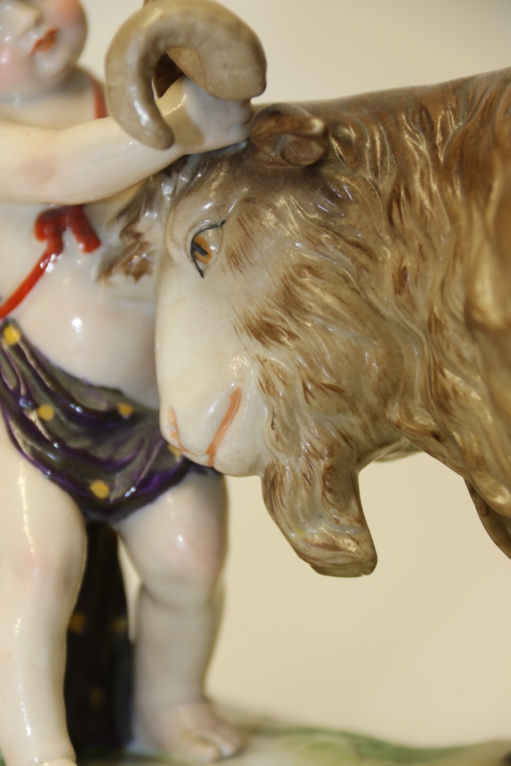 A fine Porcelain Figure Group of three Putti Wrestling with a Goat by Hochst Factory View X