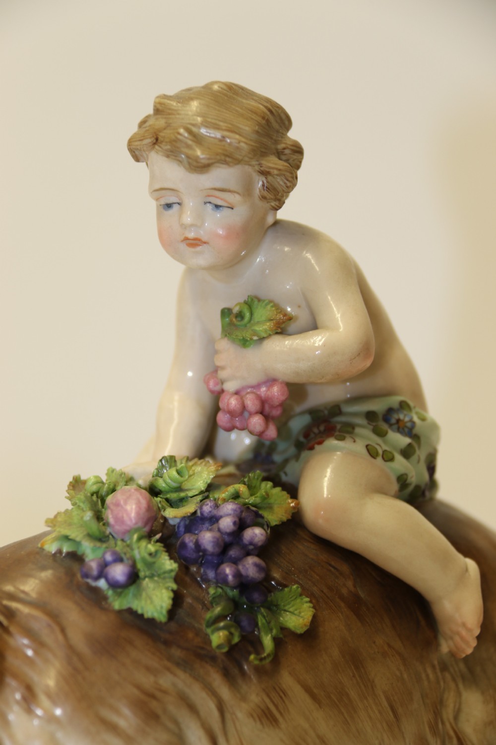 A fine Porcelain Figure Group of three Putti Wrestling with a Goat by Hochst Factory View XIV